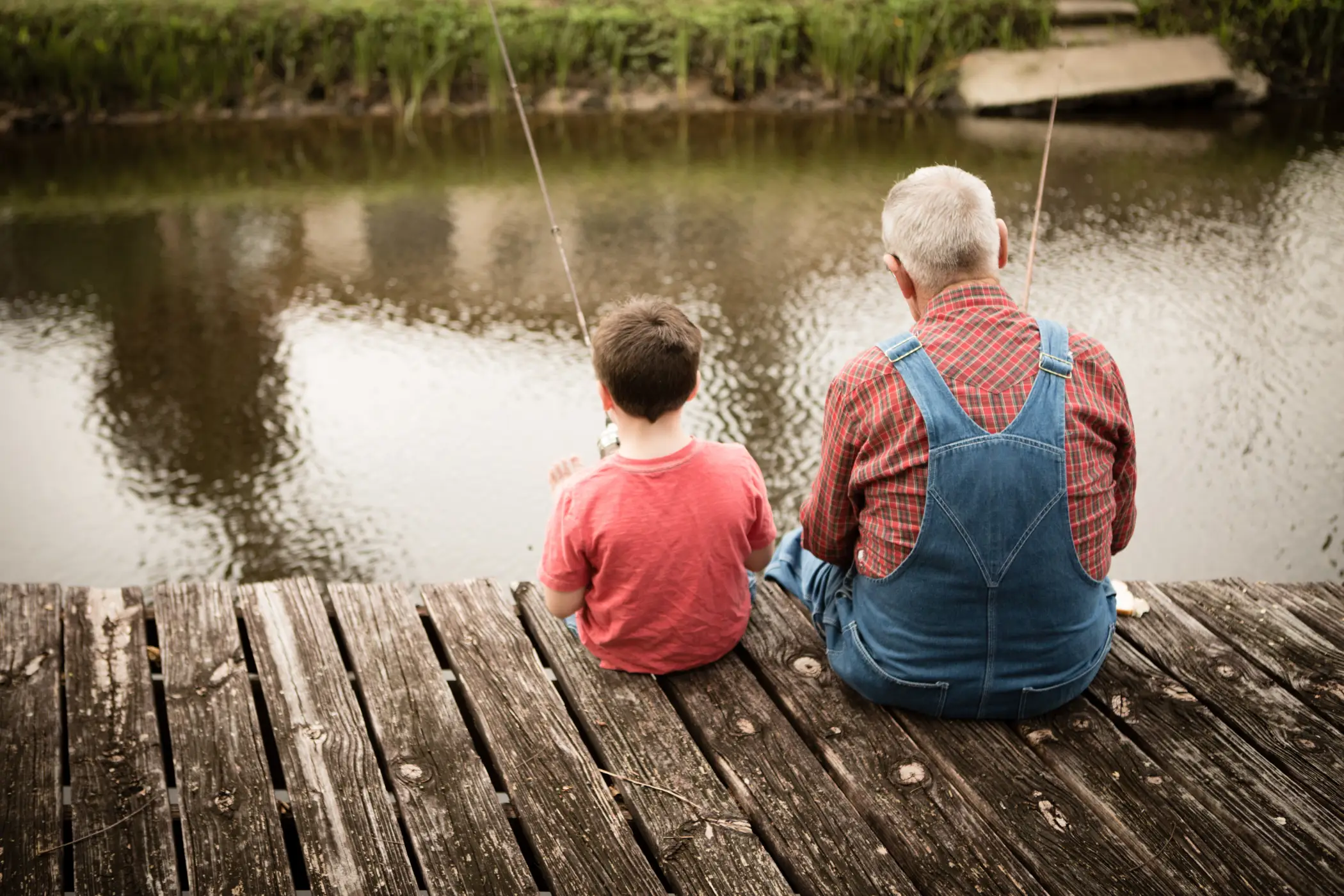 grandfather and child fishing